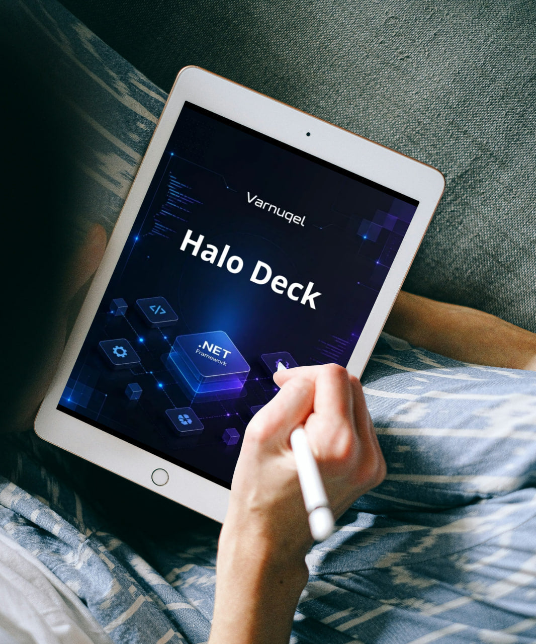 Person holding a tablet displaying 'Varnugel Halo Deck' on a bed.