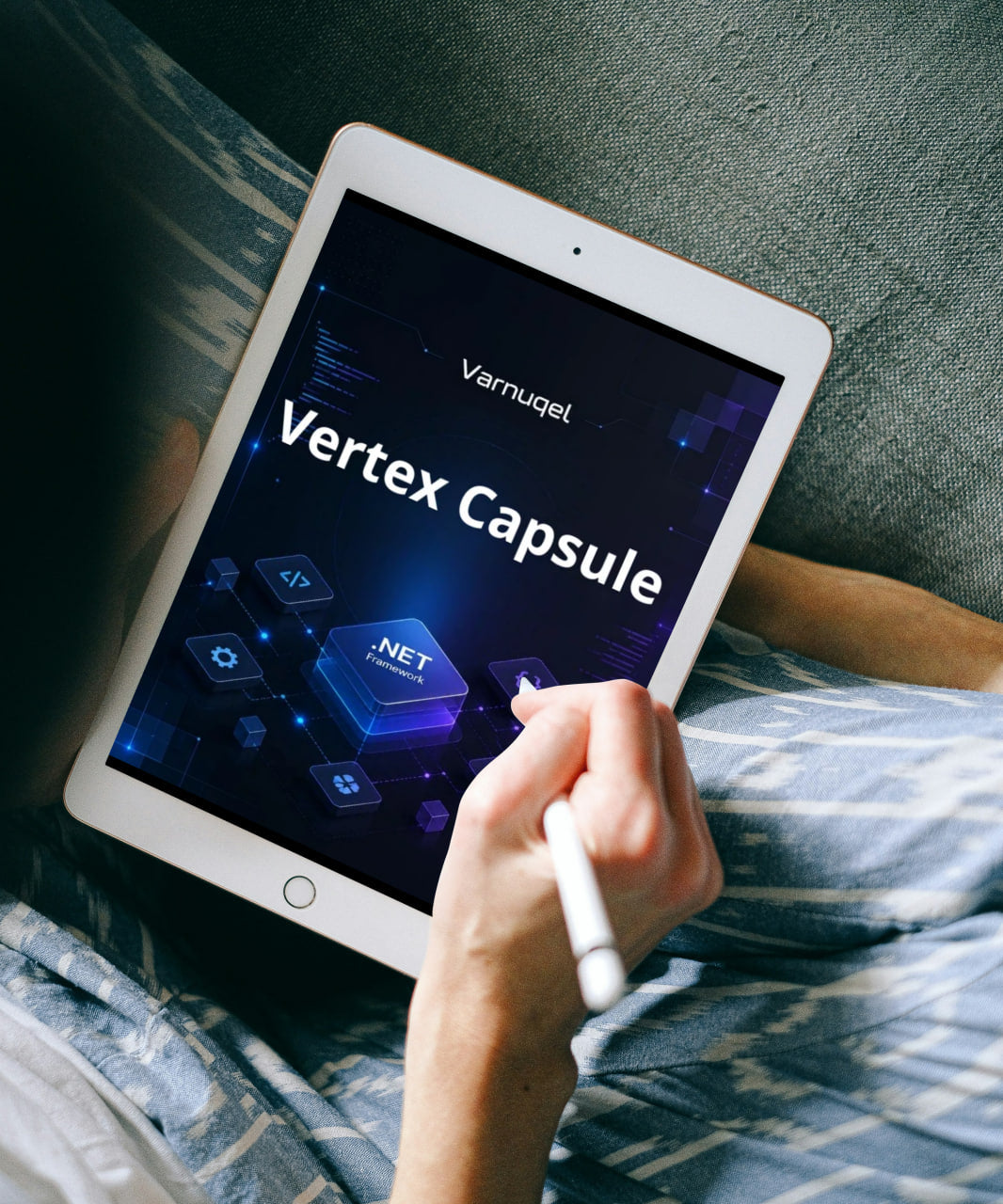 Person holding a tablet displaying 'Vertex Capsule' software on a bed.